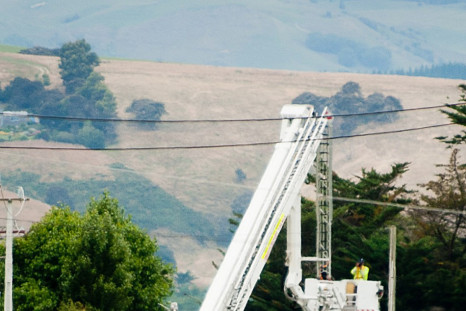 Hot Air Balloon Tragedy: A forensic photographer takes pictures at the scene of a hot air balloon crash near Caterton in New Zealand on 07/01/2012.