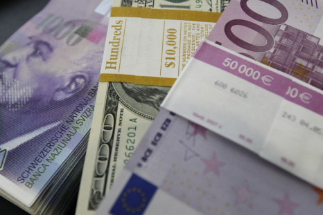 Stacks of Swiss franc, Euro and U.S. dollar banknotes