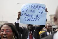 A member of the Nigerian Bar Association holds up a placard to protest a fuel subsidy removal in Lagos