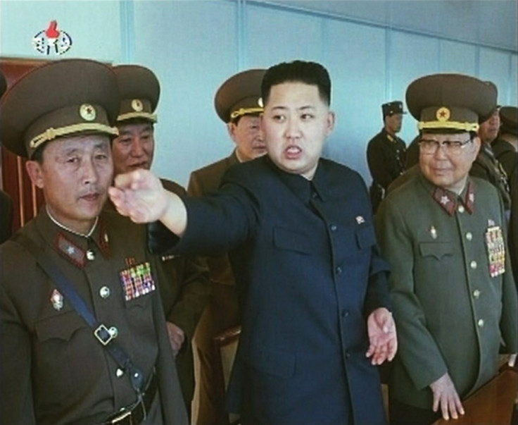 Kim Jong-un speaks while surrounded by soldiers Kim Jong-un speaks while surrounded by soldiers