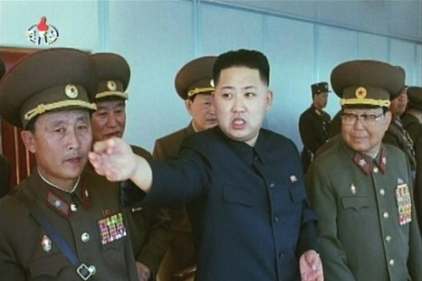 Kim Jong-un speaks while surrounded by soldiers