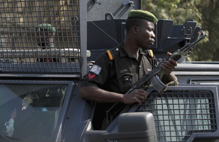 Police stand watch over protesters in Nigeria's capital, Abuja