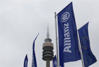German insurer Allianz flags are seen in front of Munich&#039;s radio tower before shareholders&#039; meeting