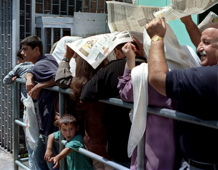 PALESTINIANS WAIT TO ENTER ISRAELI INTERIOR MINISTRY IN EAST JERUSALEM FOR PERMITS.