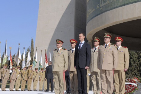 Syria&#039;s President Bashar al-Assad stands with leaders of the army
