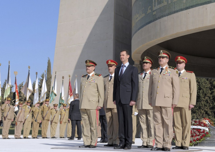 Syria&#039;s President Bashar al-Assad stands with leaders of the army