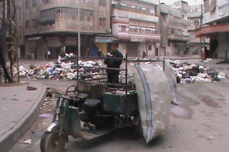 Rubbish is piled up along a street in Marat al-Numan, Syria