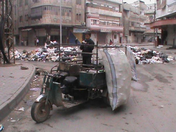 Rubbish is piled up along a street in Marat al-Numan, Syria