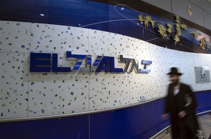 File photo of an ultra-Orthodox Jewish man walking past an El Al Israel Airlines logo at Ben Gurion airport