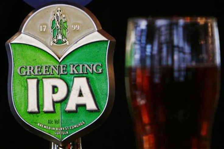 Greene King beer pump and pint of beer are seen in a pub in central London