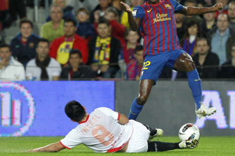 Barcelona&#039;s Eric Abidal is staying at the Nou Camp