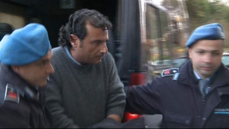 Captain Francesco Schettino of cruise ship Costa Concordia is escorted into a prison by police officers at Grosseto