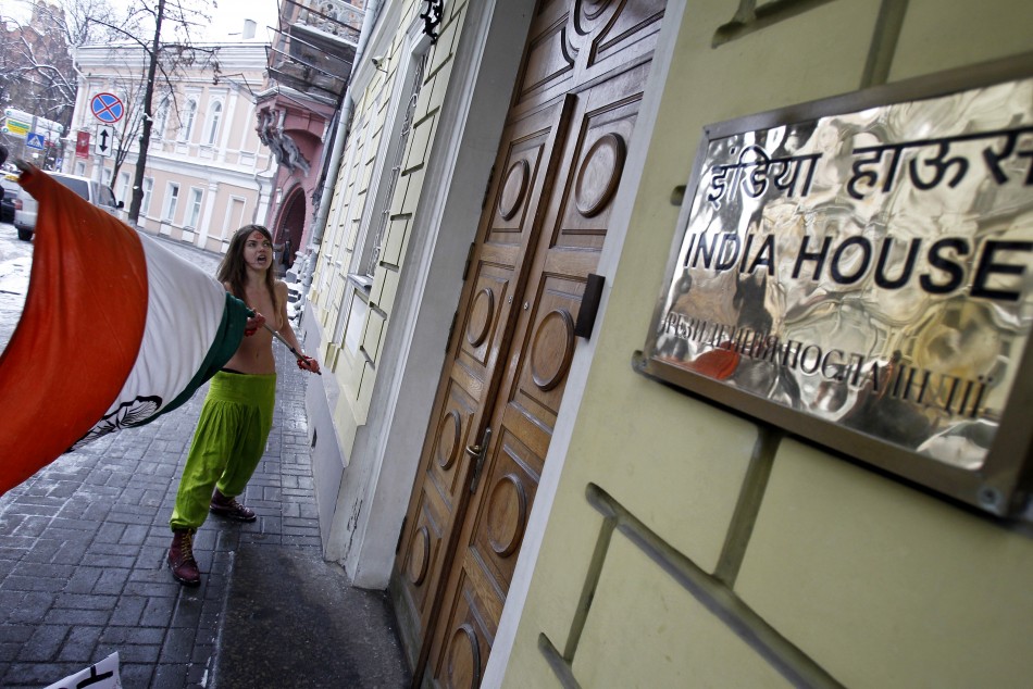 A member of the Ukrainian womens group Femen appears semi-naked outside the residence of the Indian ambassador in Kiev