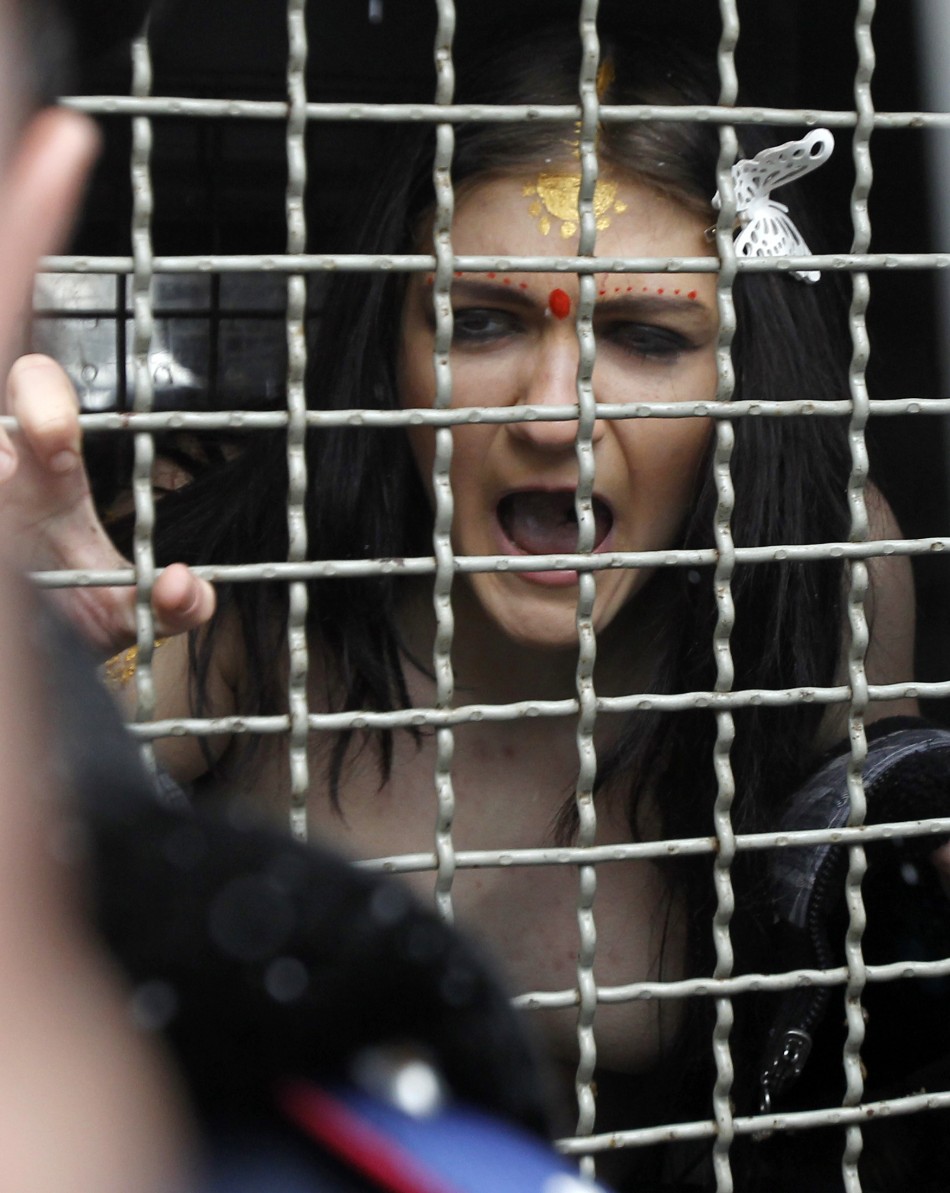 Another member of Femen is detained by police following the protest in Kiev