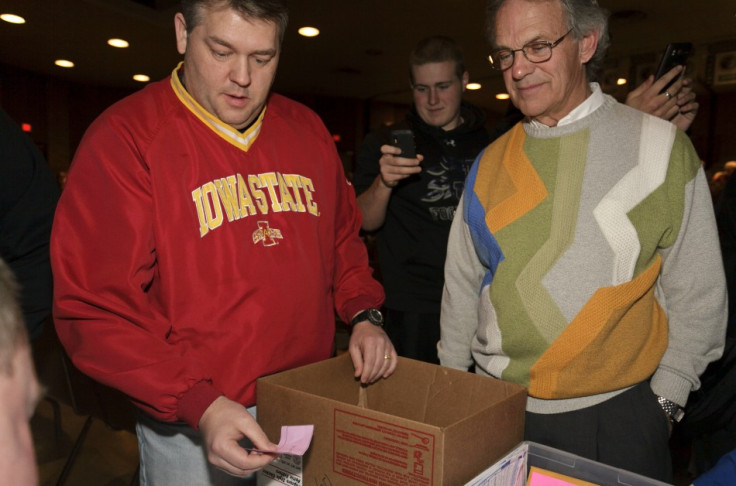 A delegate counts the votes after a caucus meeting in Iowa