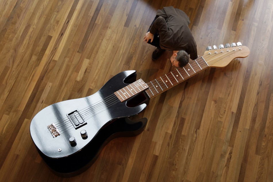 A guitar-shaped coffin