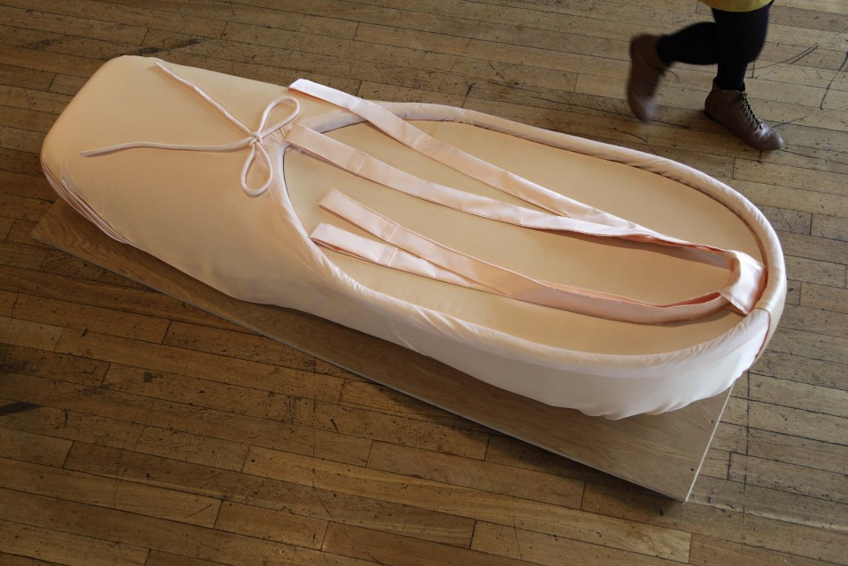 A coffin shaped like a ballet slipper