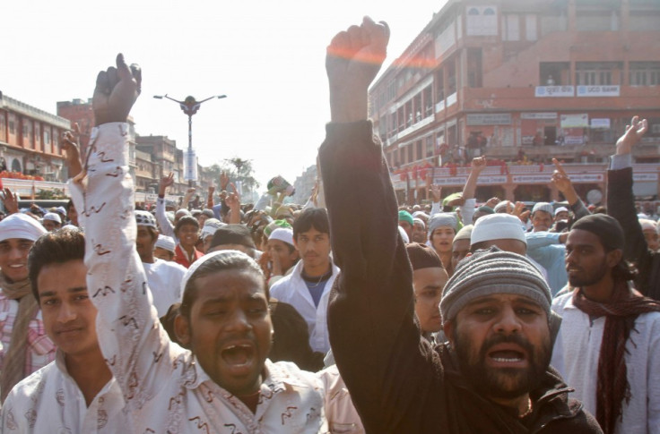 Muslims shout slogans against author Salman Rushdie, after offering their Friday prayers in Jaipur