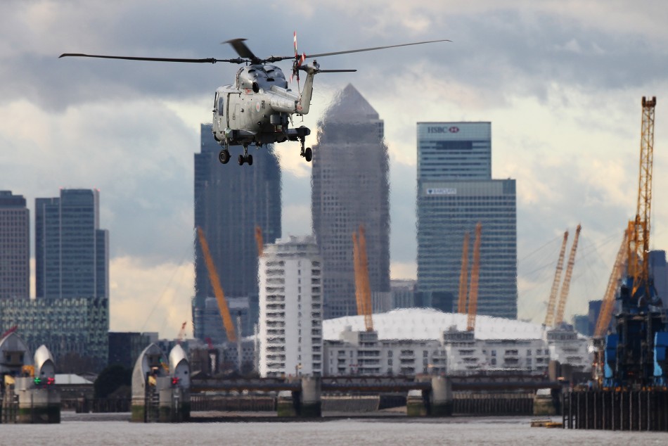 Royal Marines helicopter heads towards Canary Wharf