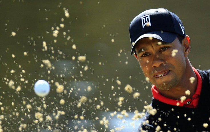 Woods of the U.S. hits out of a bunker onto the third green during the final round of the Chevron World Challenge PGA golf tournament in Thousand Oak Woods of the U.S. hits out of a bunker onto the third green during the final round of the Chevron World Challenge PGA golf tournament in Thousand Oak