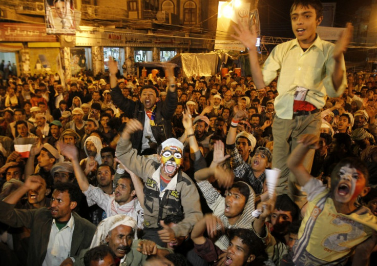 Anti-government protesters shout slogans in Sanaa