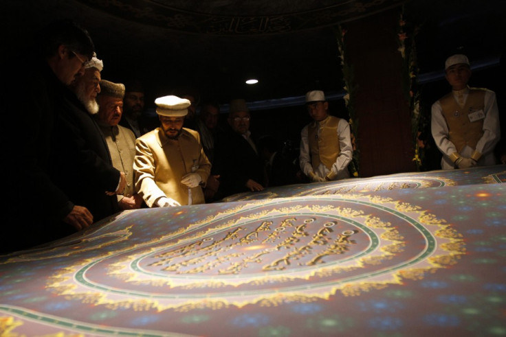 Calligrapher Mohammad Sabir Khedri with the largest Koran in the world