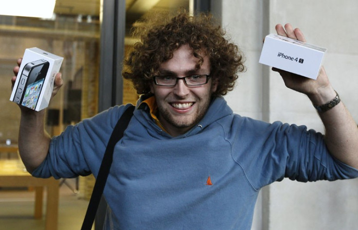 Matthew Kelly from Swansea reacts as he emerges from the Apple store with new iPhone 4S, in Covent Garden, London