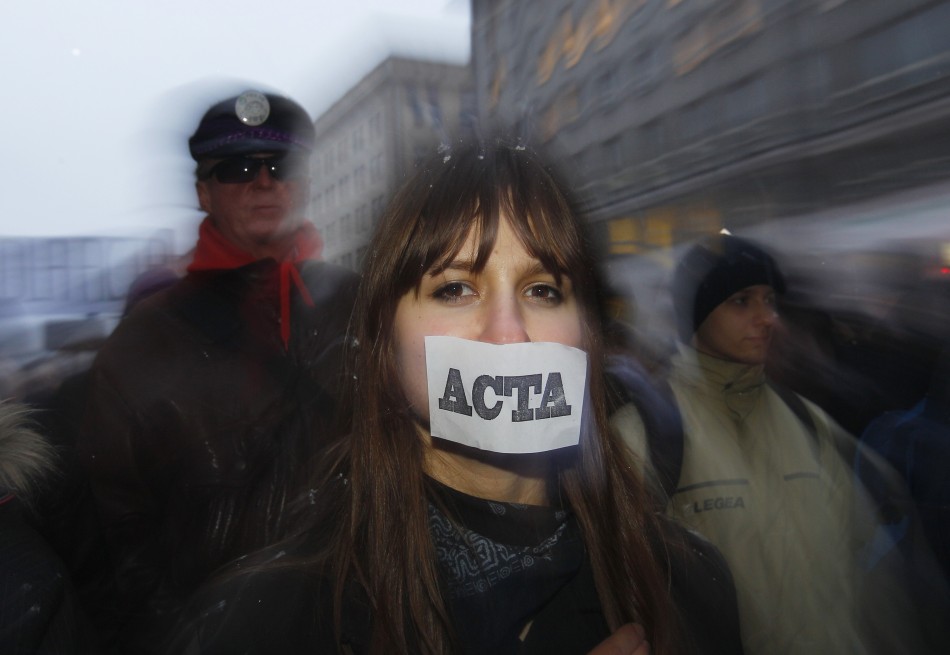 Demonstrators protest against Polands government plans to sign Acta