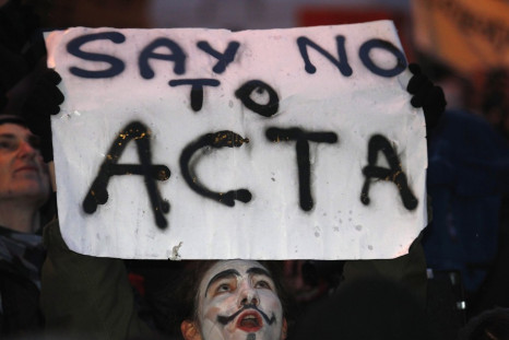 Demonstrators protest against Poland's government plans to sign Acta