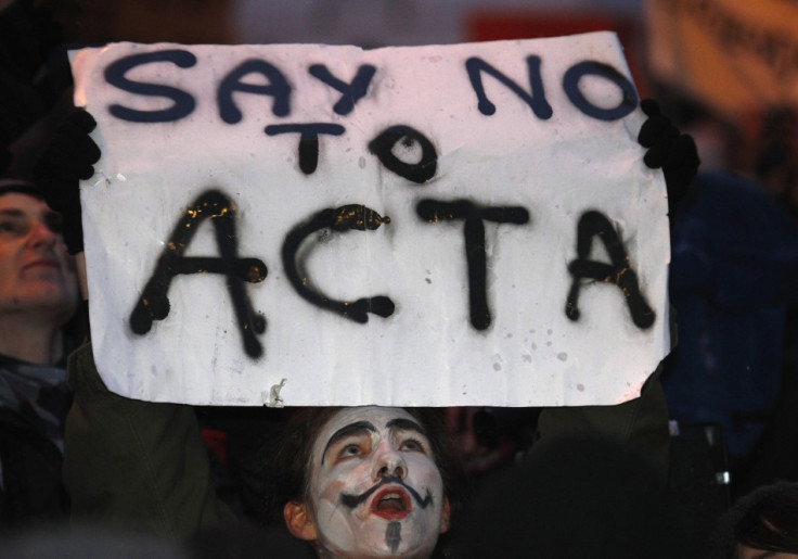 Demonstrators protest against Poland's government plans to sign Acta