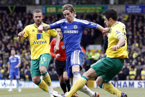 Norwich City&#039;s Fox and Martin challenge Chelsea&#039;s Torres during their English Premier League soccer match in Norwich