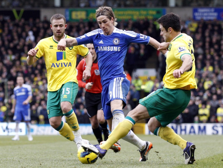 Norwich City&#039;s Fox and Martin challenge Chelsea&#039;s Torres during their English Premier League soccer match in Norwich