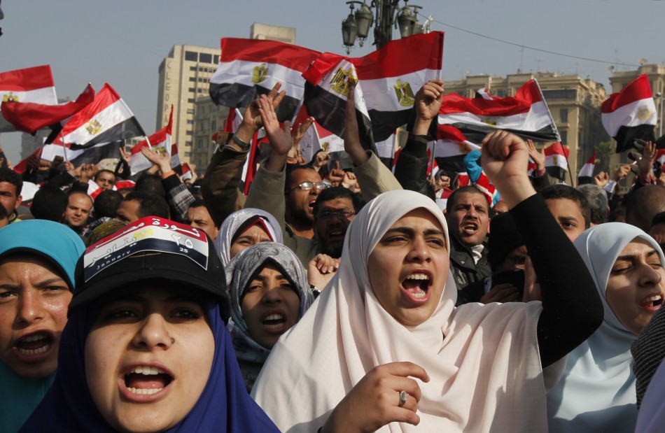 Demonstrators take part in a protest marking the first anniversary of Egypts uprising at Tahrir Square in Cairo