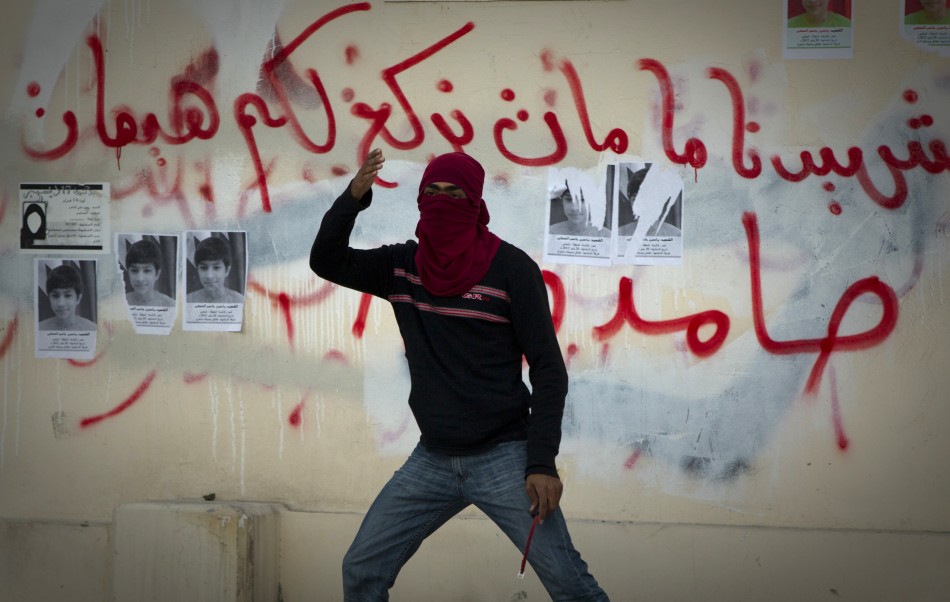 A protester gestures during a standoff with police after a mourning procession