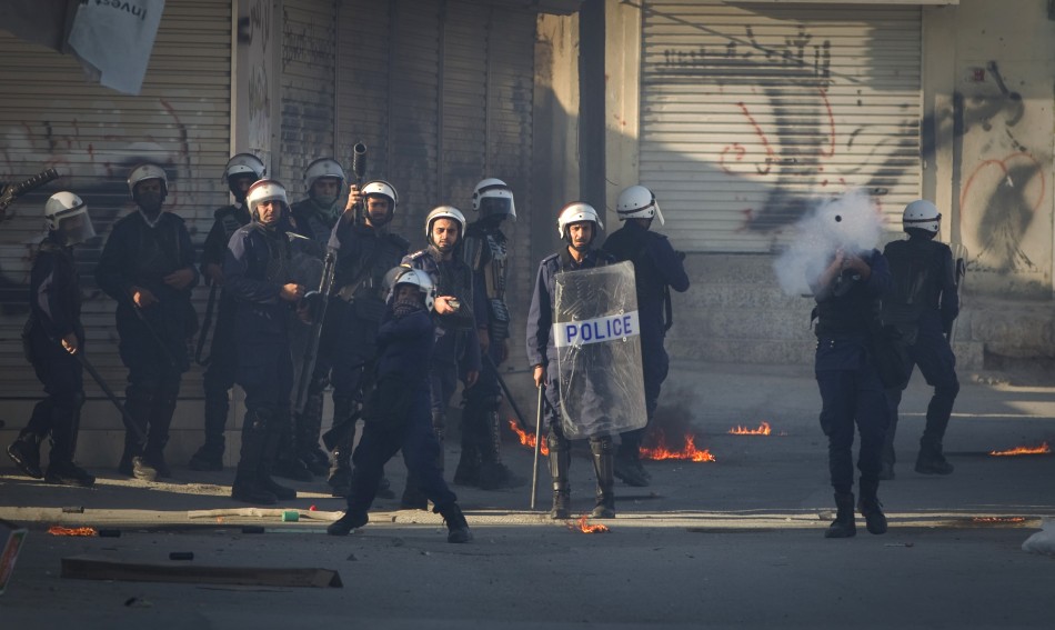 Police fire tear gas during a standoff with protesters after a mourning procession on the third day after the death of Yassin Al-Afsoor in the village of Mameer
