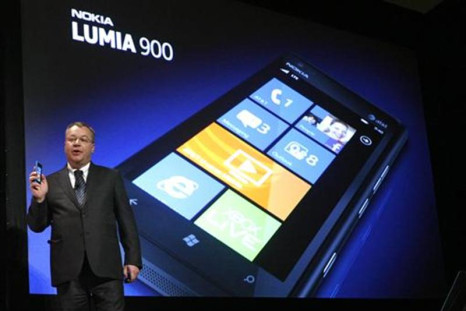 Nokia CEO Stephen Elop displays the Nokia Lumia 900 smartphone at the Consumer Electronics Show opening in Las Vegas