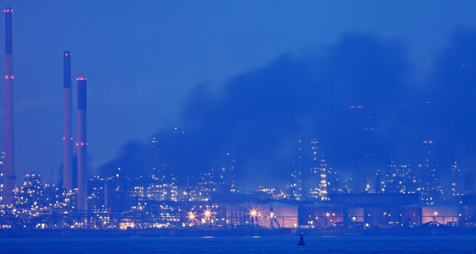 7. Royal Dutch Shell RDS, Netherlands Smoke billows from Royal Dutch Shells Pulau Bukom offshore petroleum complex in Singapore at dusk September 29, 2011