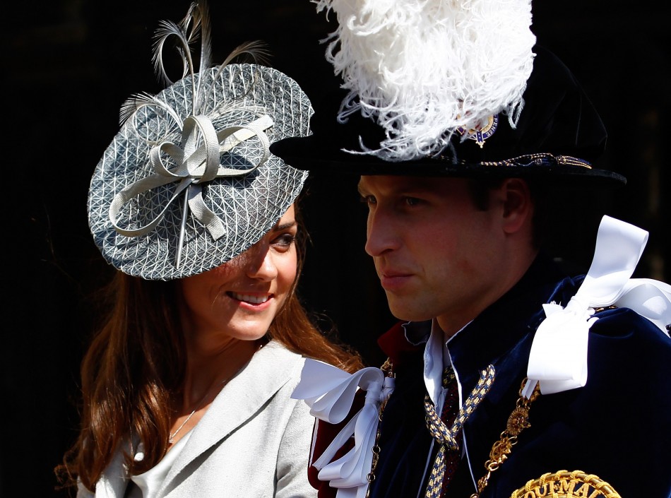 Britain039s Catherine, Duchess of Cambridge L, sits next to her husband Prince William as they leave the Order of the Garter service at St. George039s chapel inside the grounds of Windsor Castle, in Windsor, southern England