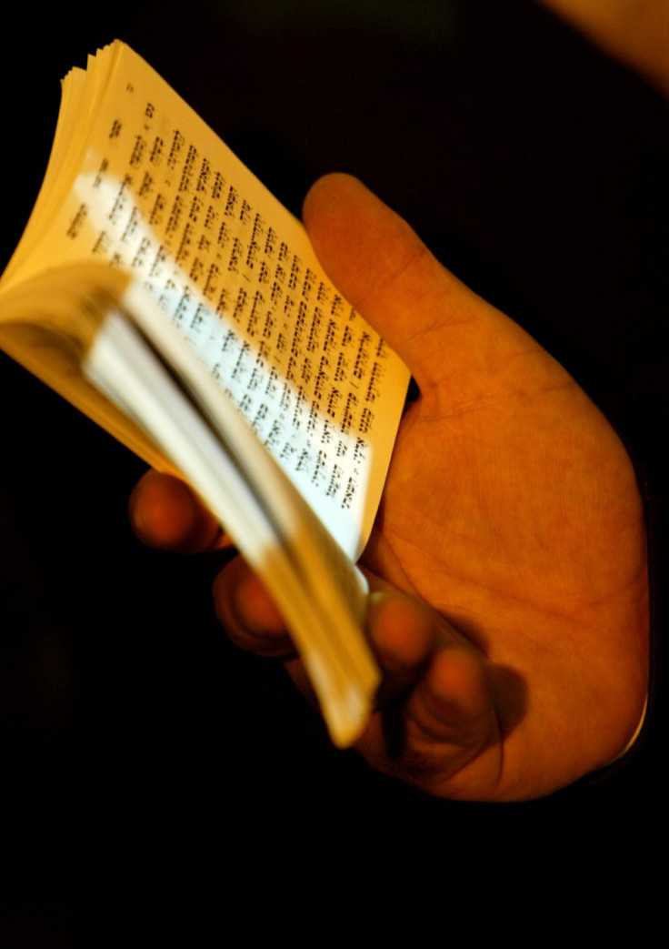 An ultra orthodox Jew holds a Torah book