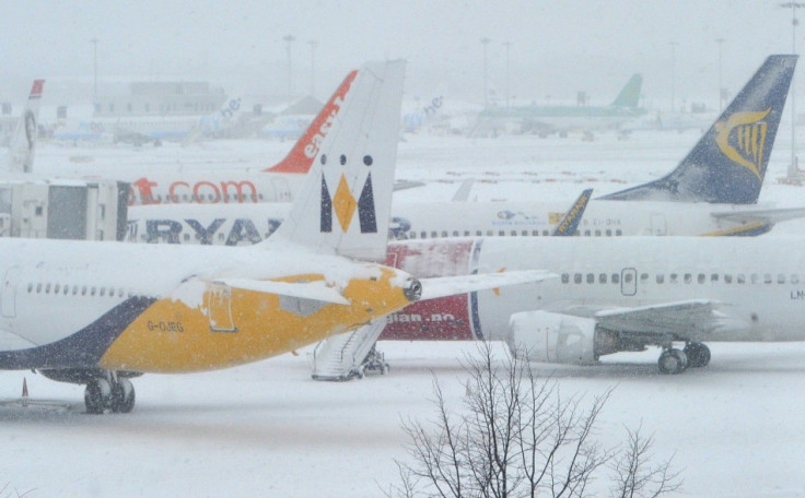 Planes sit on tarmac at Gatwick Airport during heavy snowfall in December 2010