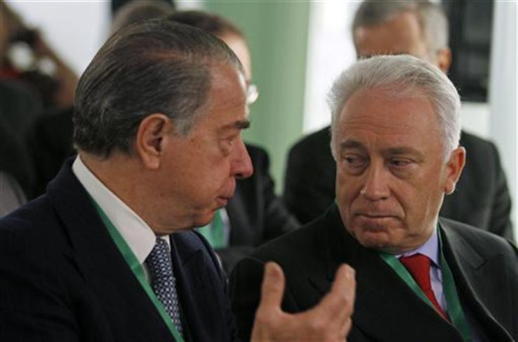 ECB governing council member Costa listens to Portuguese bank BES CEO Salgado before a financial conference in Lisbon