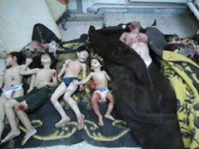 Bodies of a family whom activists say were killed by the Syrian government army, are seen at a medical centre in Karm al-Zeitoun near Homs Bodies of a family whom activists say were killed by the Syrian government army, are seen at a medical centre in Karm al-Zeitoun near Homs