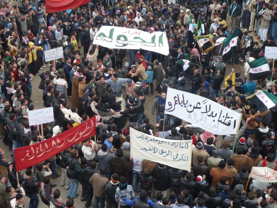 Demonstrators protest against Syrias President Bashar al-Assad in Hula, near Homs