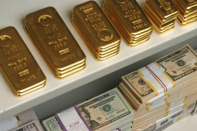 Gold bars and dollar bills of various denominations