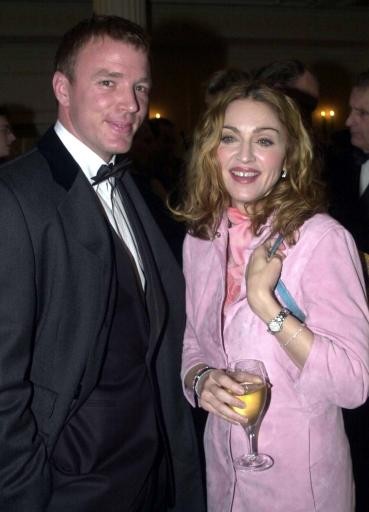 American singer Madonna carrying a Fendi handbag with her boyfriend British film director Guy Ritchie