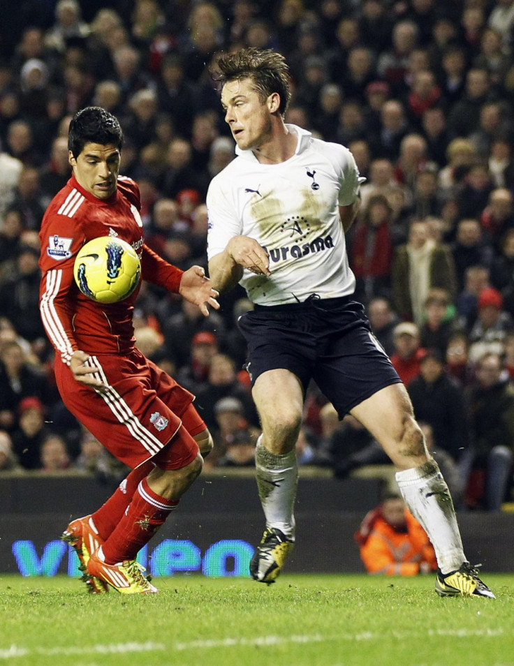 Liverpool&#039;s Suarez challenges Tottenham Hotspur&#039;s Parker during their English Premier League soccer match at Anfield