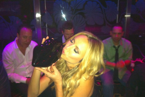 Stacy Keibler with her lip-shaped clutch