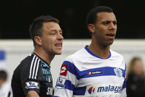 Queens Park Rangers' Anton Ferdinand is marked by Chelsea's John Terry before a corner kick during their FA Cup soccer match at Loftus Road in London