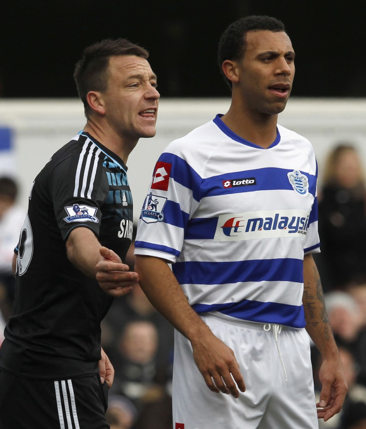 Queens Park Rangers' Anton Ferdinand is marked by Chelsea's John Terry before a corner kick during their FA Cup soccer match at Loftus Road in London