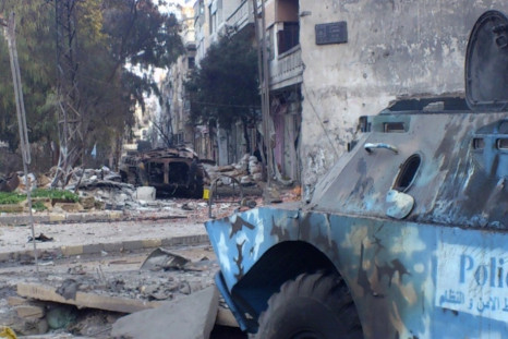 Wreckage of armoured military vehicles after clashes near Khaldiyeh area in Homs